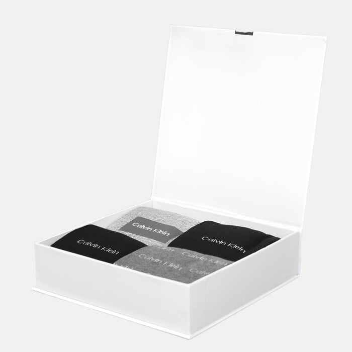 an open gift box containing 4 pairs of calvin klein socks